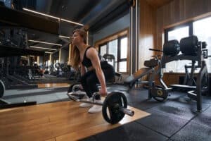 woman using a hex bar