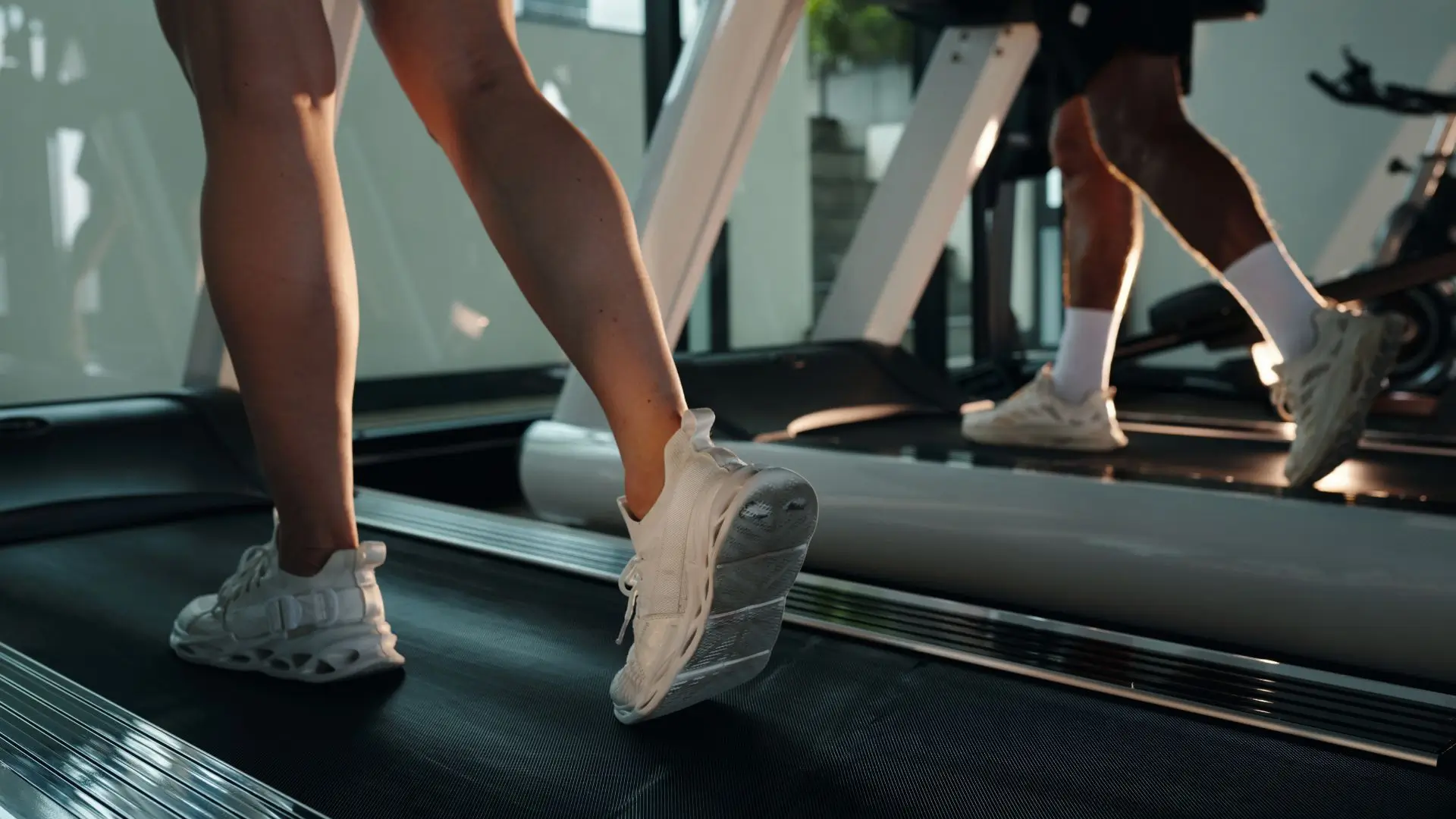 picture shows the legs of runners on a refurbished treadmill